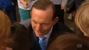 Tony Abbott tries out his schoolboy French