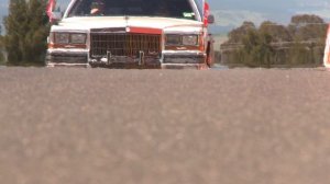 Todd and Rick Kelly drive laps of Mount Panorama Bathurst in 1989 V8 Cadillac stretch limousine