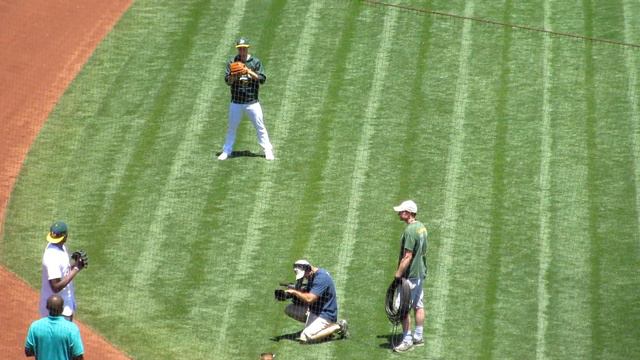 Festus Ezeli warms up and throws out first pitch at Oakland Athletics game