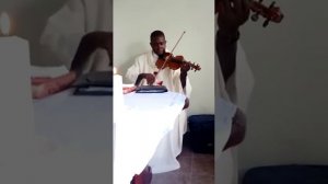 That's Father John Fisher Kayizi