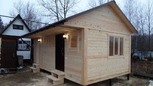 Баня из бруса с сараем