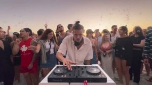 playing house music on the beach until people dance