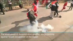 Palestinians dressed as Santa Claus protest in Bethlehem