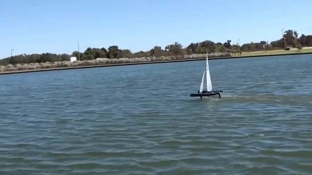 Two Mini40  radio control trimarans hydrofoiling at Austin Lakes, Mandurah, West Australia