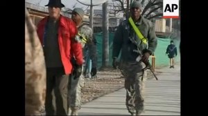 British soldiers patrolling on Xmas Day; US soldiers in Bagram base