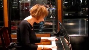 Elena Kuschnerova testing piano at Barge Music