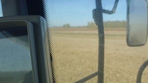 Зерноуборочный комбайн акрос 580,выгрузка бункера.