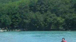 Me waterskiing on Torch Lake behind a pontoon boat