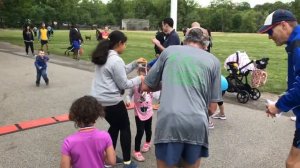 Frank Shorter hands out medals at children's race