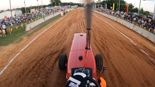 Brian Morrison in the driver's seat at Leonardtown MD Hot Farm Tractor Pull Farmall 1206