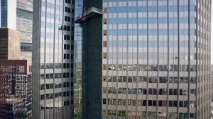 Scanclimber SC8000 mast climber cladding the 148 m Eurotower skyscraper in Frankfurt, Germany