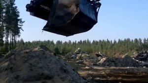 Просеивающий ковш MultaVEX Rotor на просеивании грунта