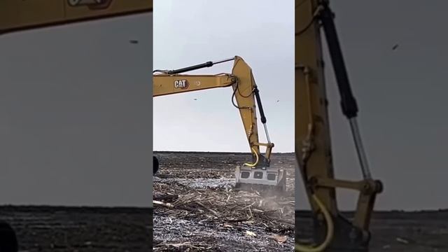 Mulcher fae ex150 in  crawler excavator cat330 clears the territory of trees in Russia