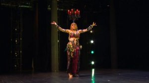 Belly dancing star Neon - balancing a real candelabrum (not a bellydance shemadan with a crown!)