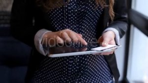 Woman Uses a Tablet and Credit Card Standing Near a Window - Stock Footage | VideoHive 15474995