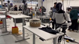 Tesla's Optimus Gen 2 Robot Amazingly Folds a T-Shirt: See the Future of Robotics in Action!