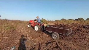 Kubota с автомобильным прицепом