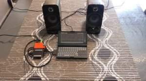 HP200LX Palmtop PC with Adlib Soundcard plays Commander Keen 4 thru a PCMCIA Parallel port card...