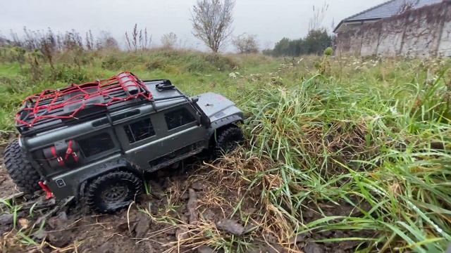 1:10 Scale RC Car Traxxas Trx-4 Land Rover Defender D110 in forest adventure