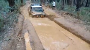 land rover defender 110 with a TD5 Engine in mud.