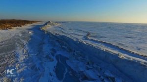 Giant wall of ice forms on China-Russia border lake