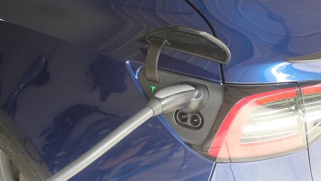Tesla travel vs wall charger how fast does it charge ?