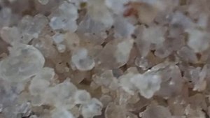 Песок под микроскопом.