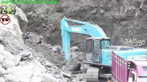 Excavator Digging Sand And Loading Into Dump Truck Kobelco SK200-10