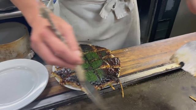 Iconic Japanese savory pancake called Okonomiyaki in Fukuoka | Japanese food