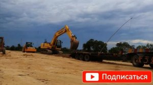 Погрузка тяжелой техники на трал.