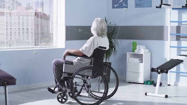 Handicapped senior man on wheelchair looking out window смотреть онлайн
