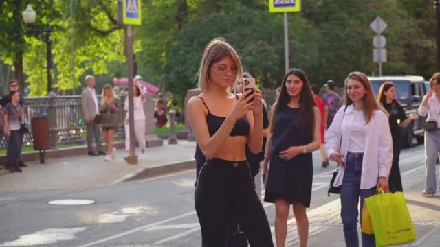 Beautiful girls on the famous Moscow street Patriarch s Ponds.