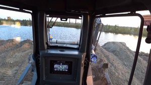Бульдозер Д15 ДСТ-Урал принимает песок. Russian bulldozer D15 pushes sand into the swamp.