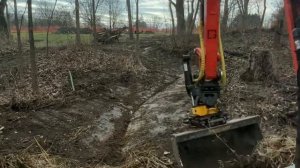 Engcon tilt rotator on kubota kx 057 building a creek and nature play area for kids at local park