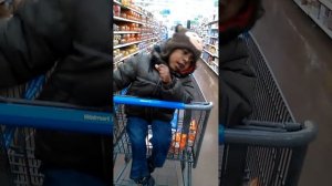 Boy shouting in Shopping Cart