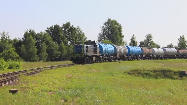 ST48-066 (PKP Cargo) с поездом из 37 цистерн покидает ст. Брест-Северный