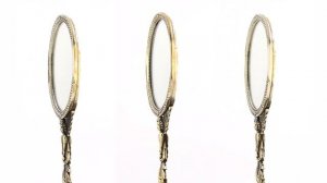 Винтажное зеркальце с изображением ангелочка на рукоятке с резным орнаментом