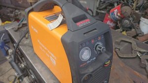 Adjusting the air pressure regulator in a Razorweld Cut 45 plasma cutter.