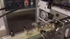 Машина индукционного типа по нанесению защитной фольги на горлышко емкости