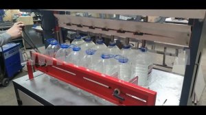 Полуавтомат для розлива жидкостей в бутыли 5 л, 1000 бутылок в час. Компания "ДЭНКАР."