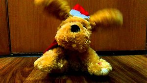 Игрушка.поющая собака.