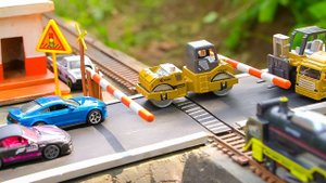 Steam Locomotive Hits Car & Tandem Roller on Railroad Crossing