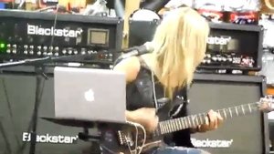 Nita Strauss - playing electric guitar -  The Trooper