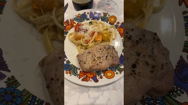 Barolo, pork tenderloin, and fettuccine in a butter cream sauce with basil and cherry tomatoes.