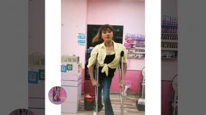 pretty young woman with polio short leg, working (sso