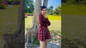 Young Model Posing and dancing in a maroon color short skirt with a Crop top | Fashion
