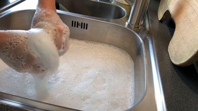 Rinsing one bottle CIF lemon cream