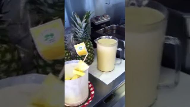 Deep fried pineapple upside down cake on a stick