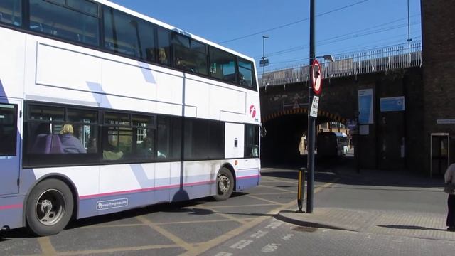 First Essex Volvo 7900 hybrid 69905 (BV13 ZBG) heads under Duke Street bridge with 33087 behind
