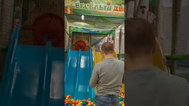 A child slid down a slide at a playground